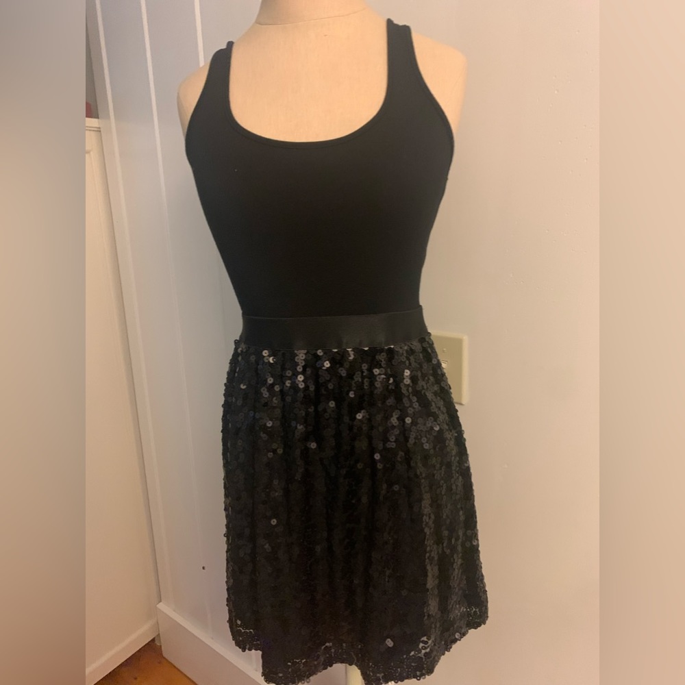 Black polyester cotton material stretch, hand wash or delicate cycle machine.